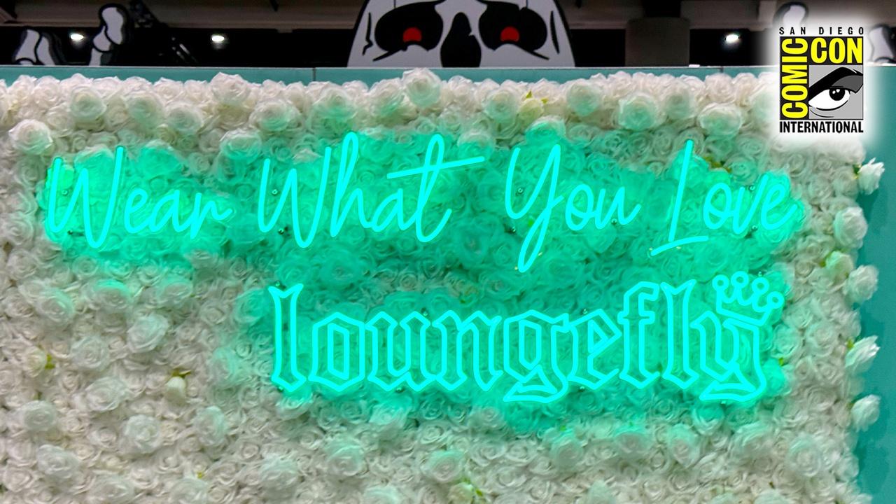 Loungefly's SDCC neon logo that reads "Wear What You Love".