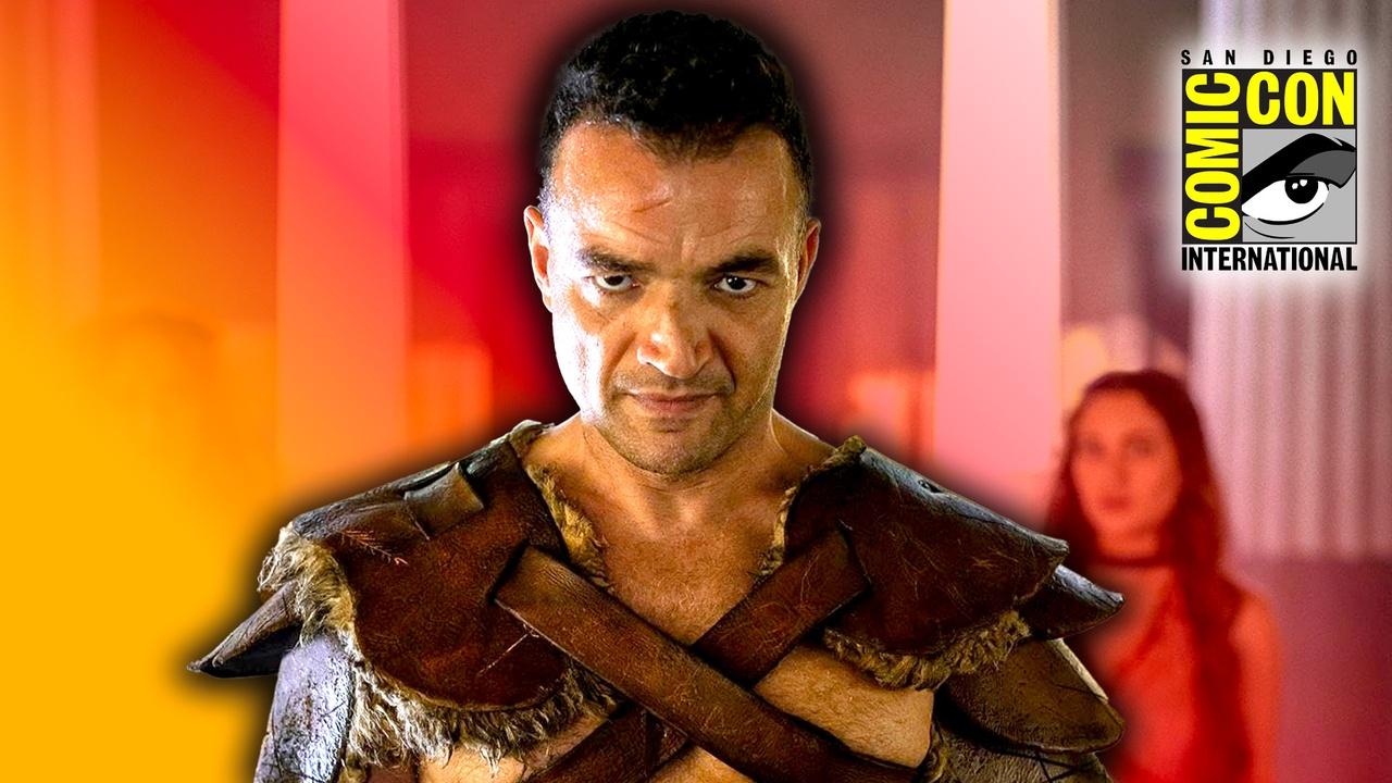 Spartacus: House of Ashur actor against orange-tinged background; San Diego Comic-Con logo in corner