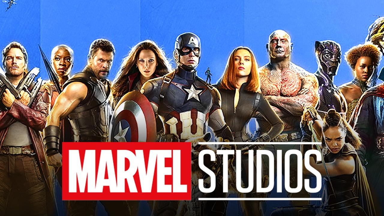 Avengers roster in front of the Marvel Studios logo.