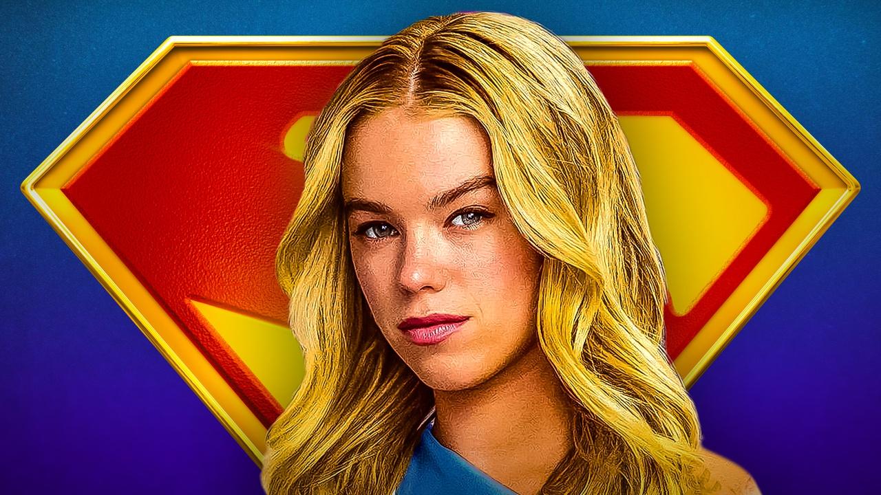 Milly Alcock Supergirl wallpaper in front of Supergirl symbol