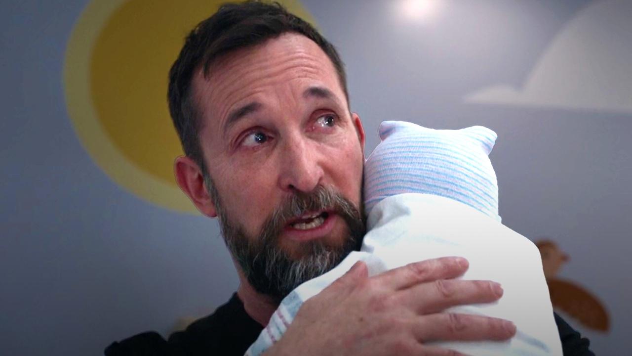 Dr. Robby holding Jane Doe.