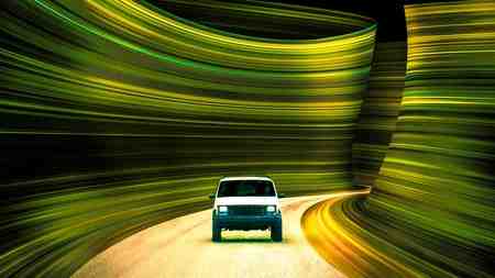 It Ends poster with car driving along wavy green-walled road.
