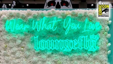 Loungefly's SDCC neon logo that reads "Wear What You Love".