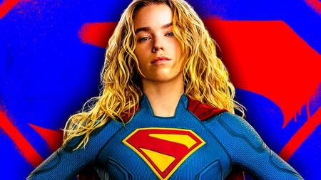 Milly Alcock's Supergirl in front of Supergirl logo.
