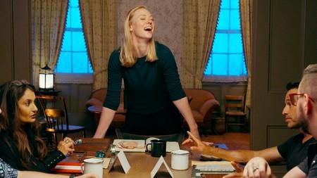 Deborah Ann Woll standing up from the table during Tales From Woodcreek.