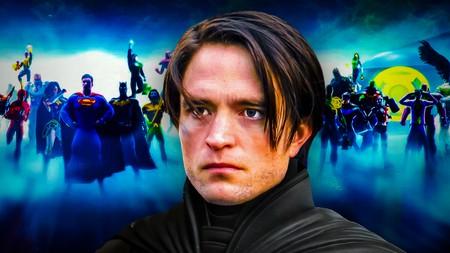 Robert Pattinson as Batman in front of DC superheroes