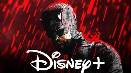 Matt Murdock in the black Daredevil costume standing in the rain in Daredevil; Disney+ logo.