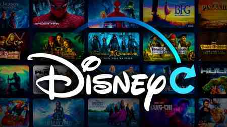Disney Plus logo, movies tiles in background.