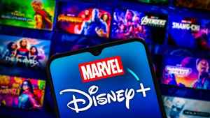Disney Plus and Marvel logo symbols with Marvel Studios movies in background