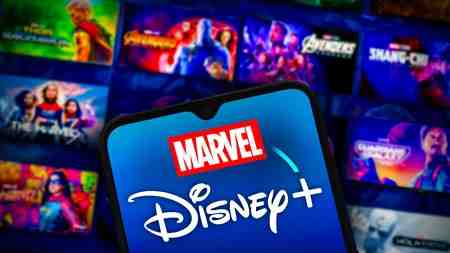 Marvel Disney Plus phone in front of streaming app background