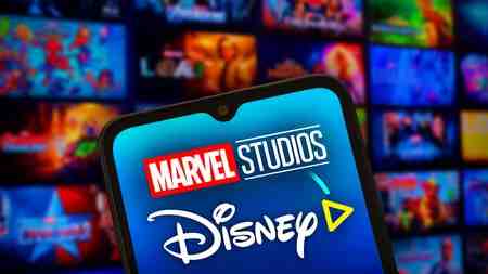 Marvel Studios and Disney Plus logos, MCU tiles in background