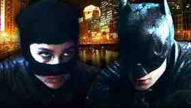 Catwoman on left, Batman on right with Chicago in background