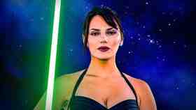 Dafne Keen Star Wars wallpaper with lightsaber