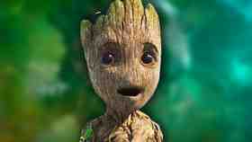 Baby Groot against a green background