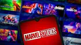 Marvel Studios logo on device, MCU movies and shows tiles in background