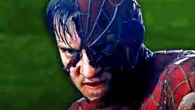 Tobey Maguire as Spider-Man with ripped mask