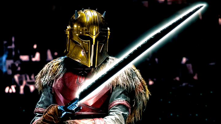 The Armorer holding the Darksaber.