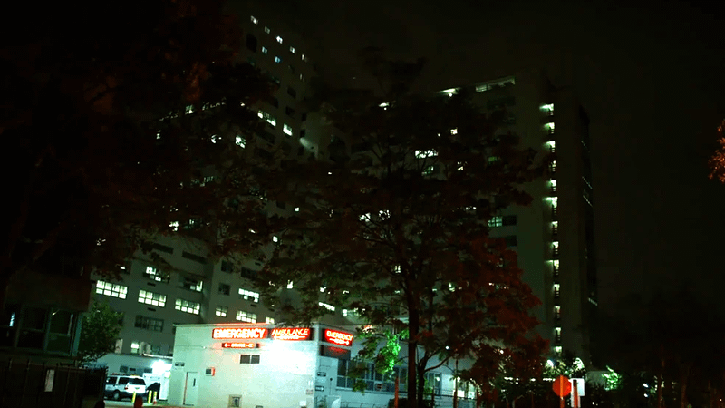 Outside shot of Metro General Hospital at night.