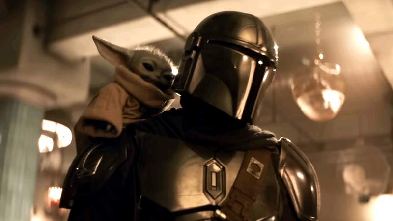 The Mandalorian with Grogu on his shoulder in The Mandalorian & Grogu