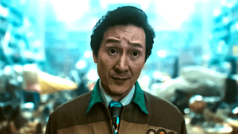 Ke Huy Quan as OB standing in a junk-filled office in Loki