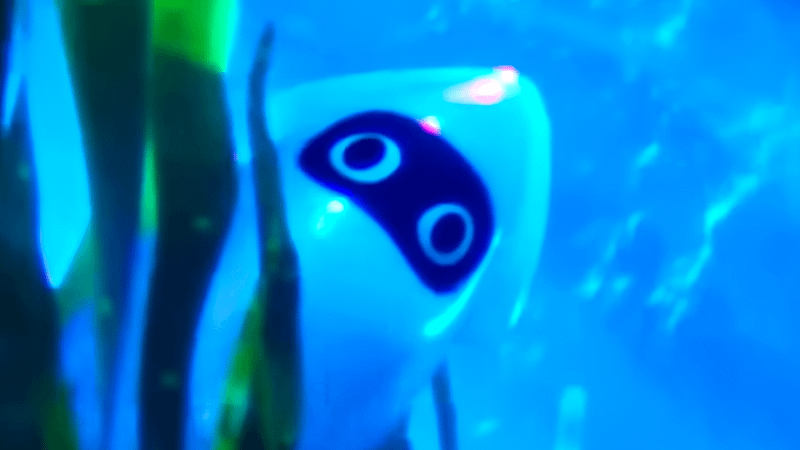 A Blooper peaking out from behind some kelp in The Super Mario Galaxy Movie.