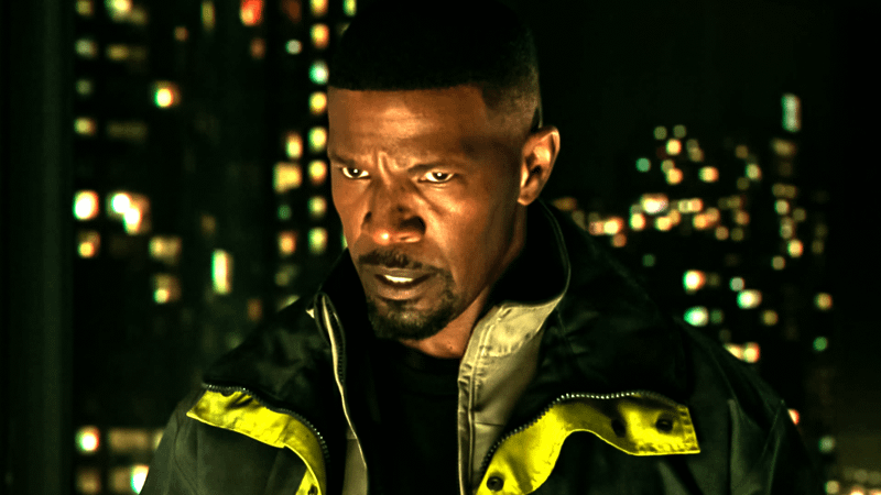 Jamie Foxx in Electro jacket in Spider Man No Way Home in front of city.