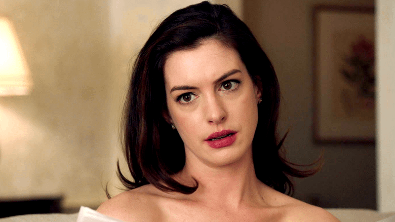 Anne Hathaway as Daphne Kluger in a white dress in Ocean's 8