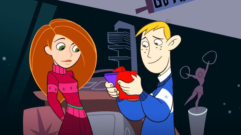 Kim handing Ron a gift in Kim Possible