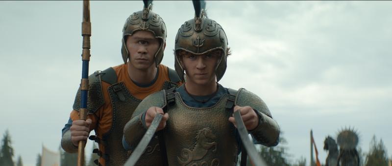 Daniel Diemer as Tyson and Walker Scobell as Percy Jackson racing on a chariot in 