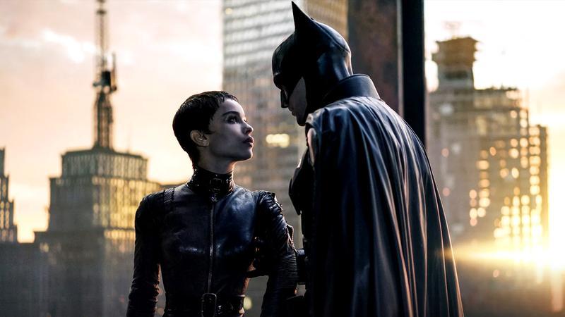 Robert Pattinson as Batman and Zoe Kravitz as Catwoman looking at each other in The Batman