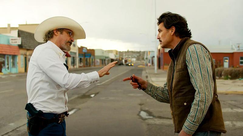 Joaquin Phoenix and Pedro Pascal arguing in Eddington