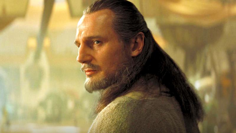Liam Neeson as Qui-Gon Jinn looking over his shoulder in Star Wars: Episode I