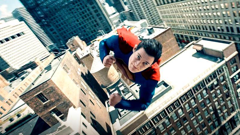 David Corenswet as Superman flying through the sky in Superman
