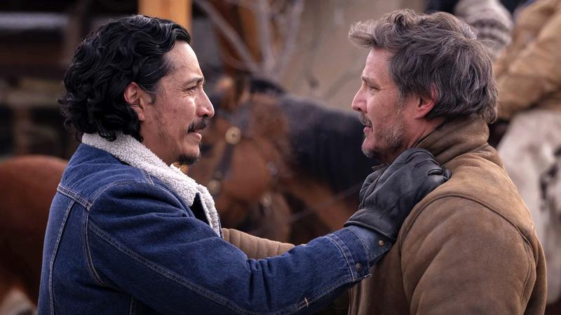 Diego Luna as Tommy Miller holding Pedro Pascal as Joel Miller in The Last of Us