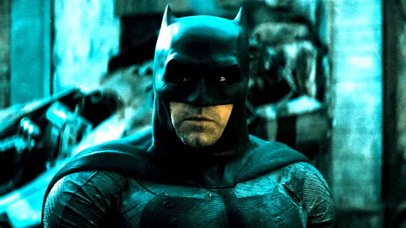 Ben Affleck as Batman in his cowl standing on a city street in Batman v Superman