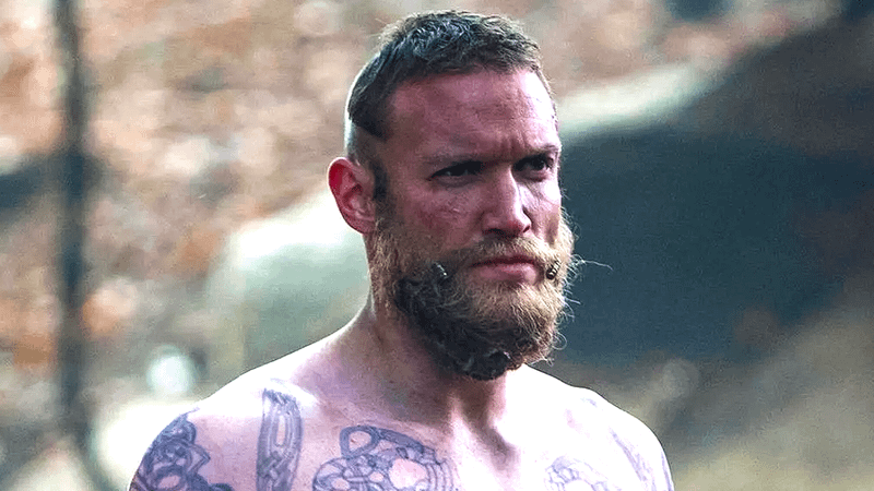 Diarmaid Murtagh shirtless with tattoos showing on upper chest.