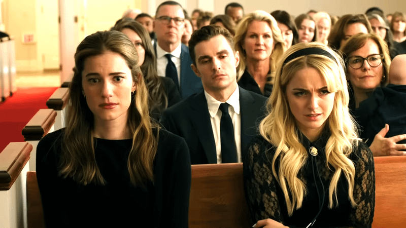 Allison Williams and McKenna Grace as Morgan and Clara next to each other in a church pew in Regretting You