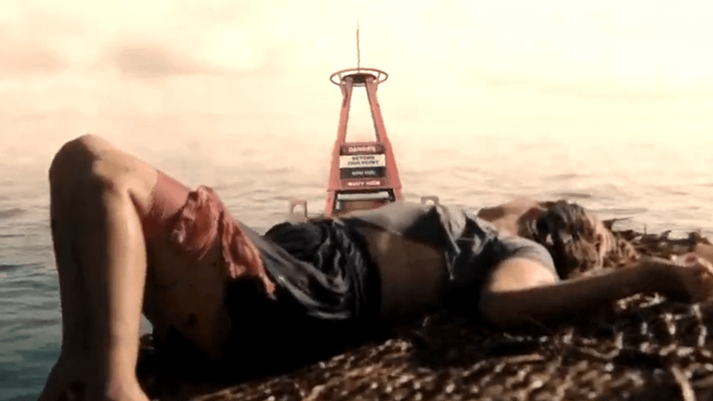 Jaelyn looking at a danger buoy.