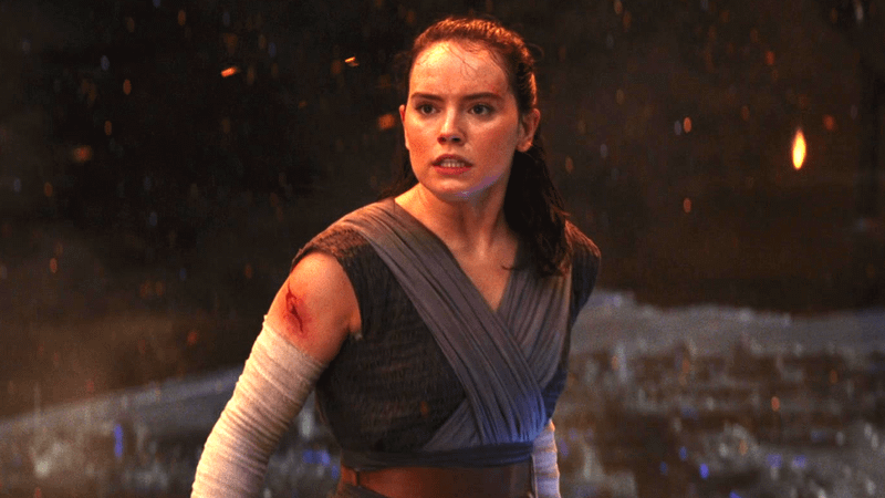 Daisy Ridley as Rey with a cut on her shoulder and her arms in wraps in Star Wars: The Last Jedi