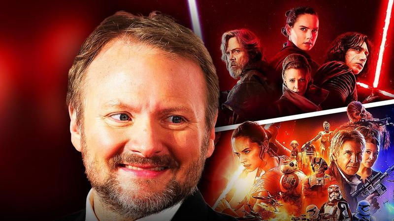 Rian Johnson next to Star Wars sequel trilogy posters.