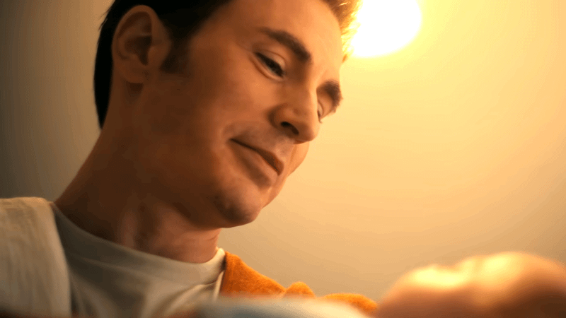 Chris Evans as Steve Rogers holding a baby in Avengers: Doomsday.