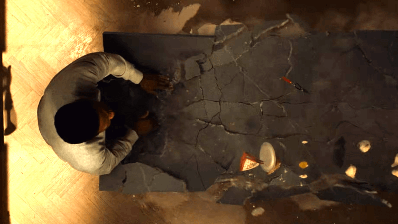 Aerial shot of Yahya Abdul-Mateen II as Simon Williams smashing a kitchen island in Wonder Man