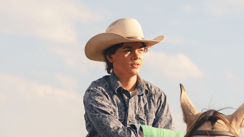 Brecken Merrill as Tate Dutton in Yellowstone