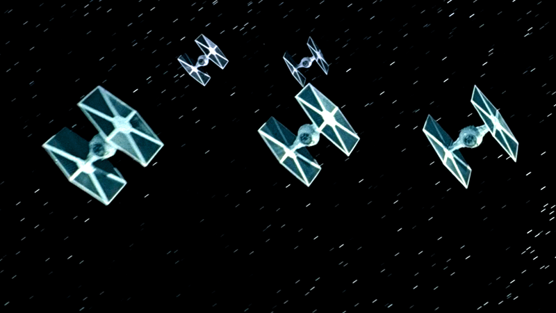 Several TIE Fighter flying through space in Star Wars