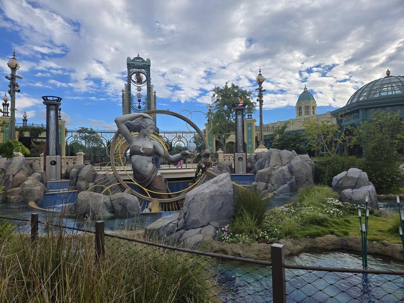 Statues and fountains in Celestial Park at Epic Universe.