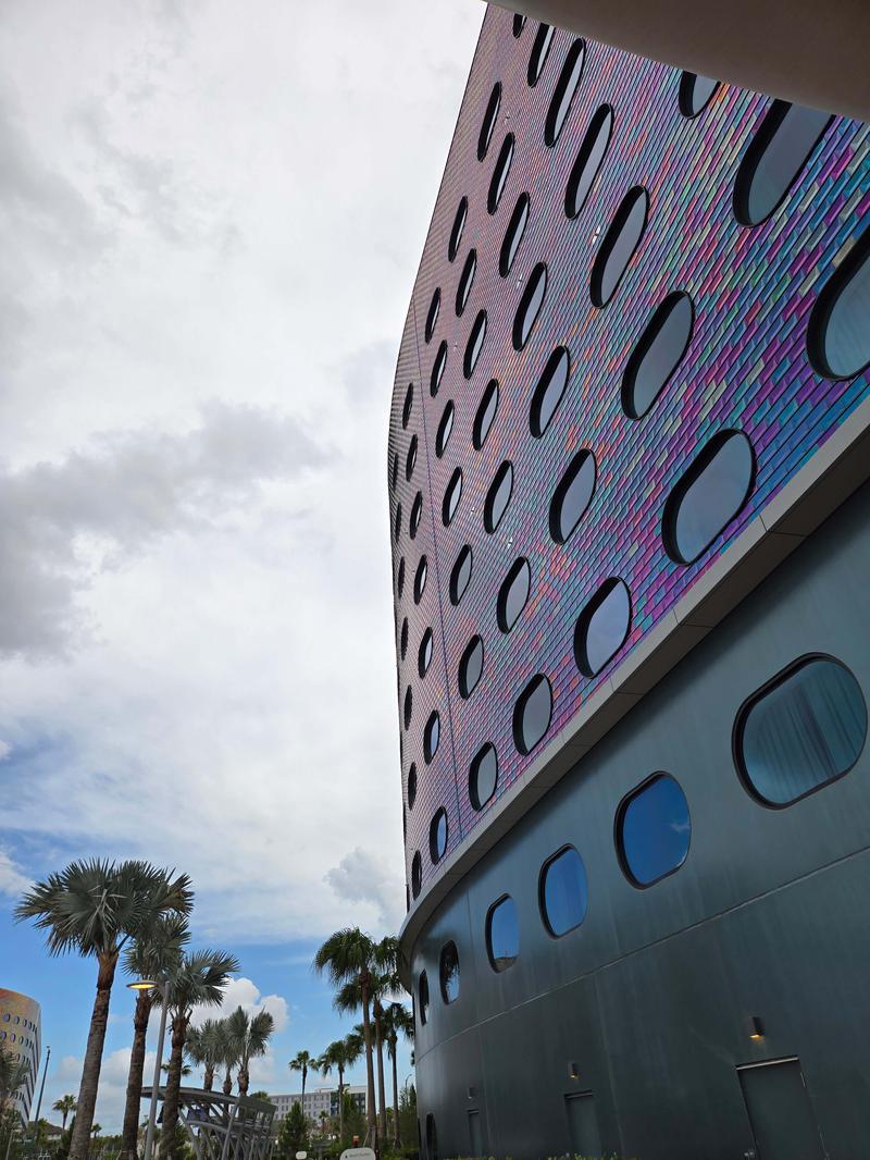 Outdoor shot of Terra Luna Resort with multi-colored tiling and oval windows.