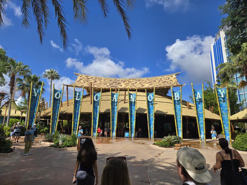 Entrance to Volcano Bay with pillars spelling out the park's name.