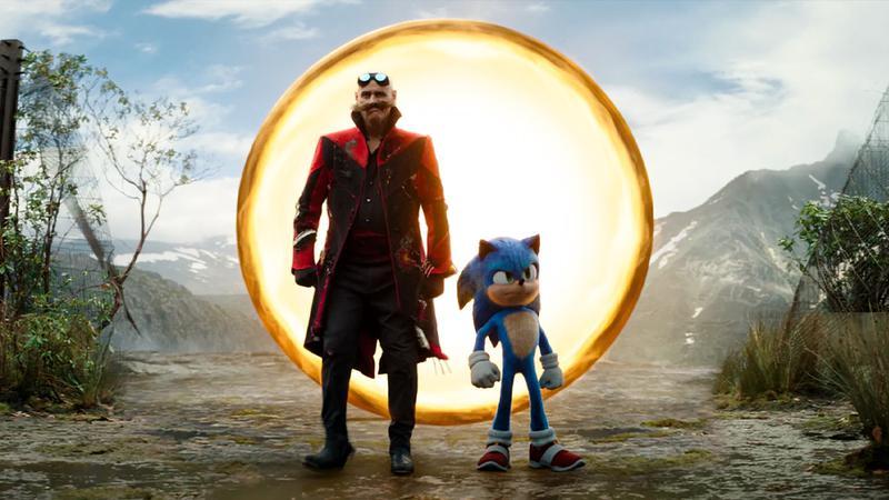 Jim Carrey as Dr. Robotnik next to Sonic coming out of a ring in Sonic the Hedgehog 2