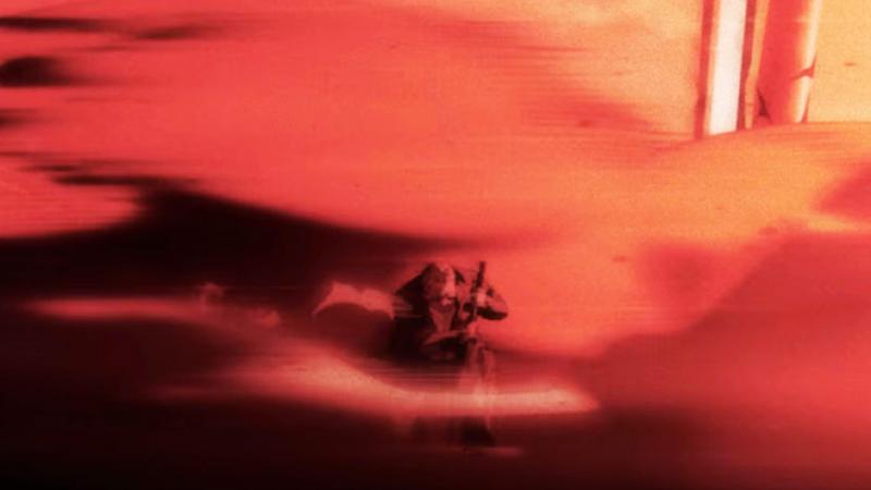 Takamura sitting in an explosion blast in Sakamoto Days