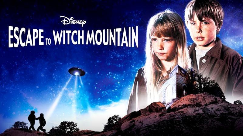 Escape to Witch Mountain title featuring two young kids with a big rock in front of them